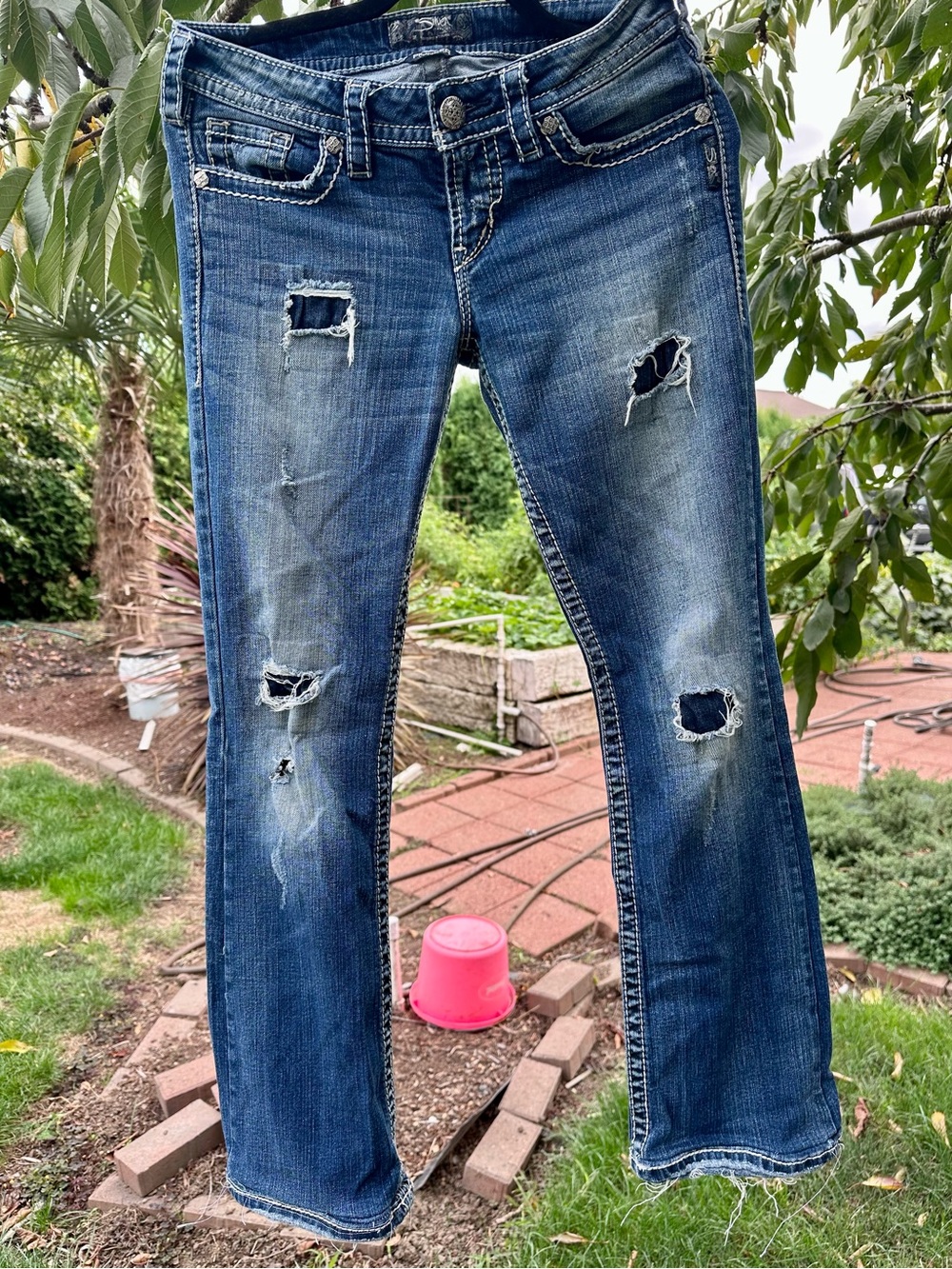 Silver Jeans Co. Pioneer Boot Cut Distressed Jeans. Boot Cut Jeans Blue Waist